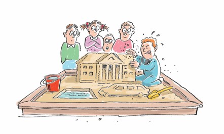 Barn i sandkassen. Ett barn bygger et slott.