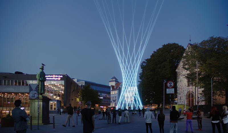 Lys som stråler opp i himmelen ved siden av domkirken i Stavanger. 