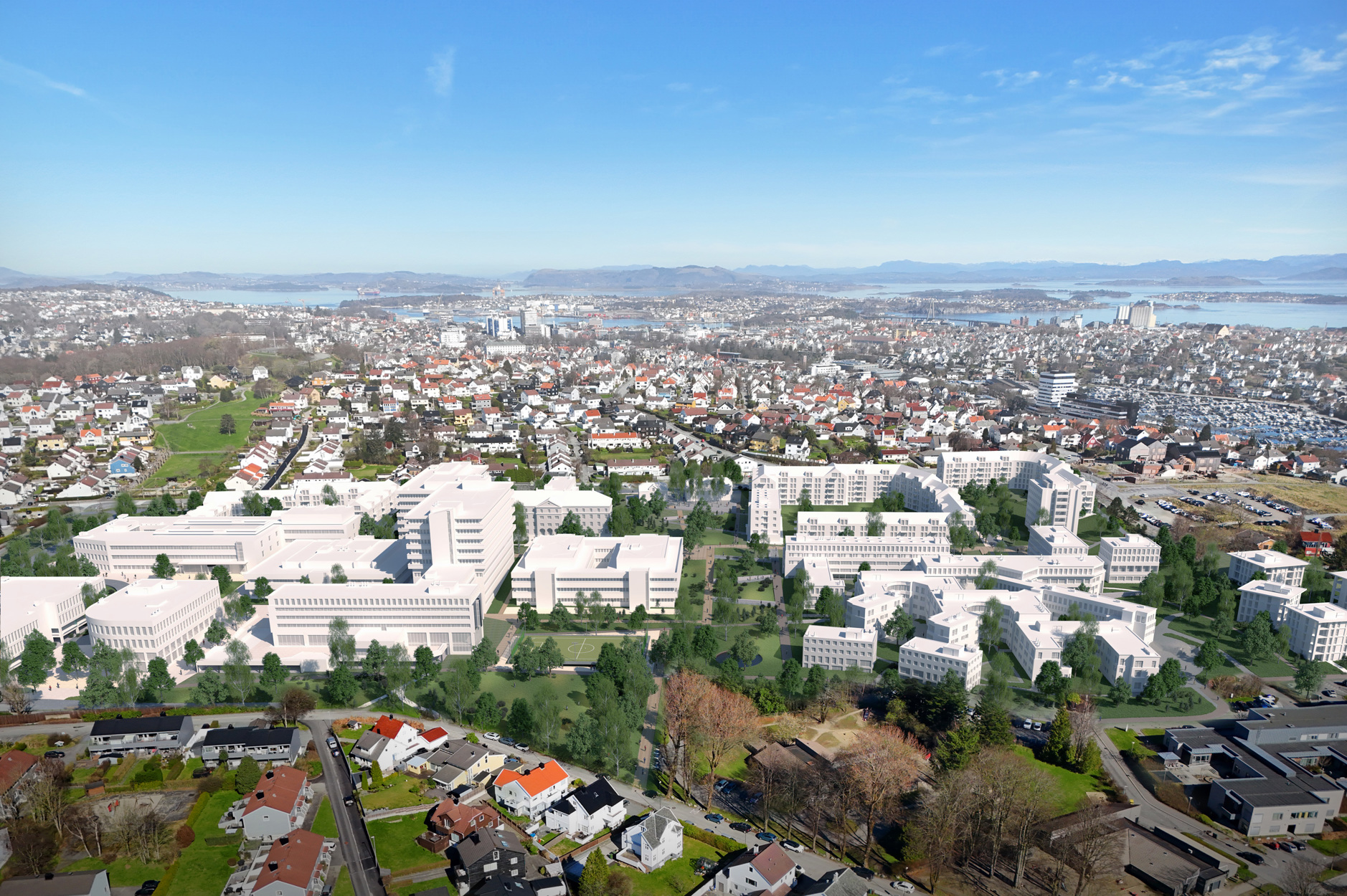 Utbygd planområde i fugleperspektiv. Nye bygg er markert med hvit farge og vi ser at en del av de gamle sykehusbyggene er beholdt, mens nye bygg, i samme høyde eller litt lavere, er kommet til.